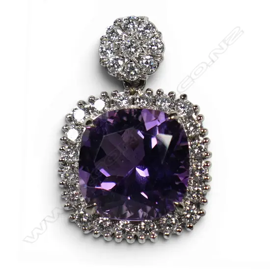 An 18ct white gold amethyst and diamond pendant,