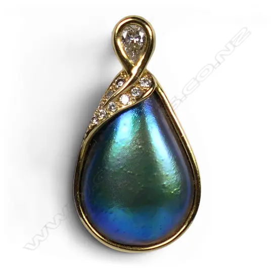 An 18ct gold diamond and paua pearl pendant,