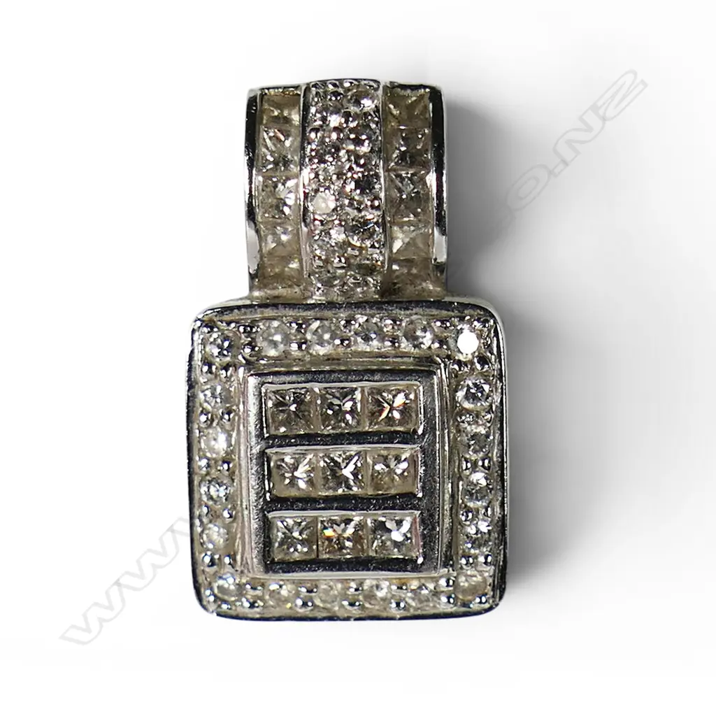 An 18ct white gold and diamond pendant, Image 1++