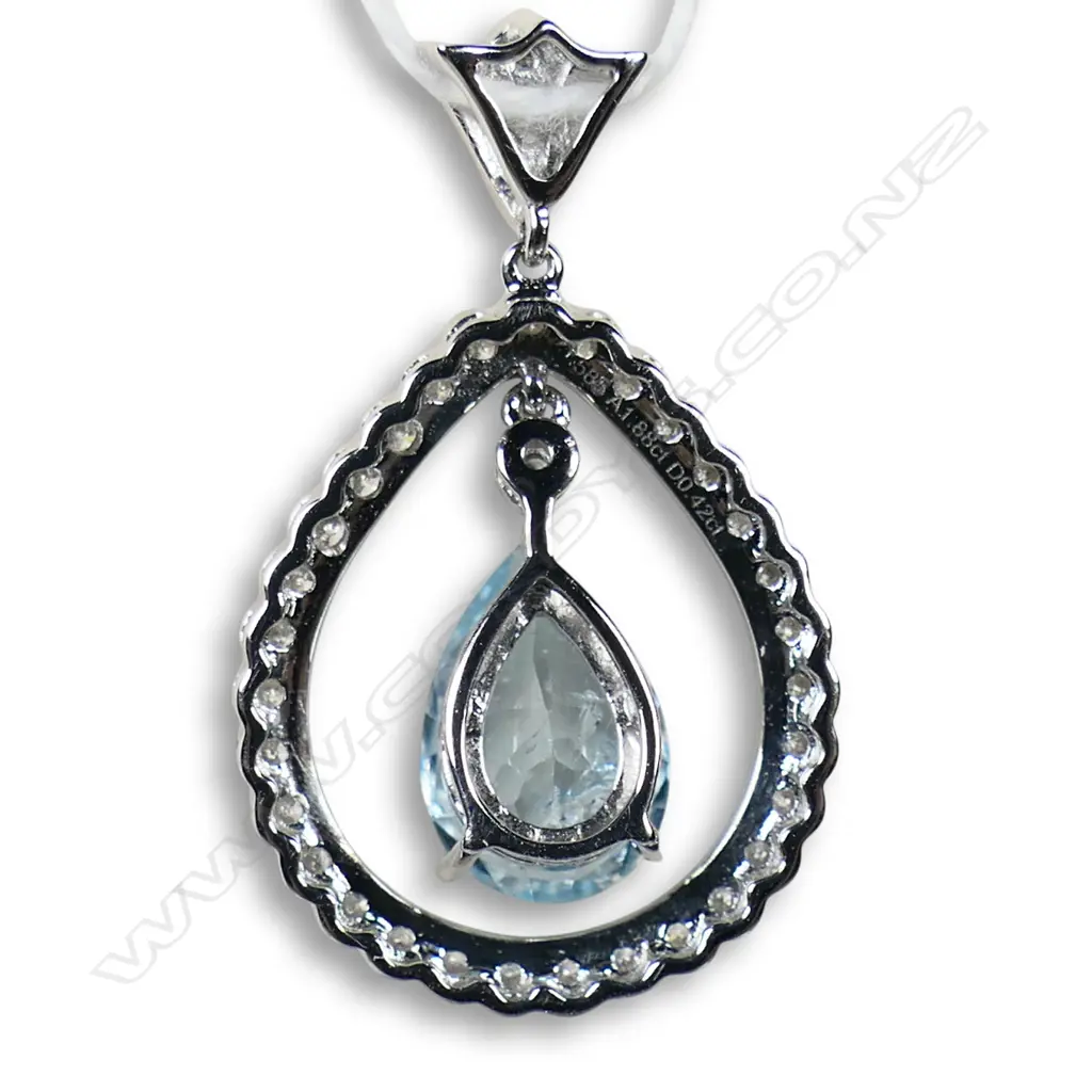 A 14ct white gold diamond and aquamarine pendant, Image 1++