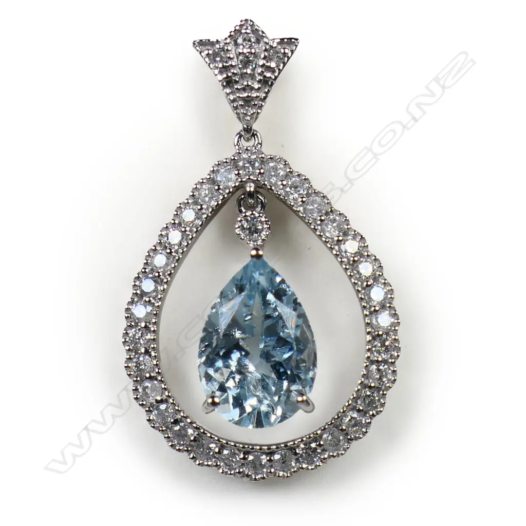 A 14ct white gold diamond and aquamarine pendant, Image 1++