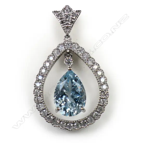 A 14ct white gold diamond and aquamarine pendant,