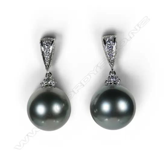 A pair of platinum diamond and South Seas black pearl earrings,