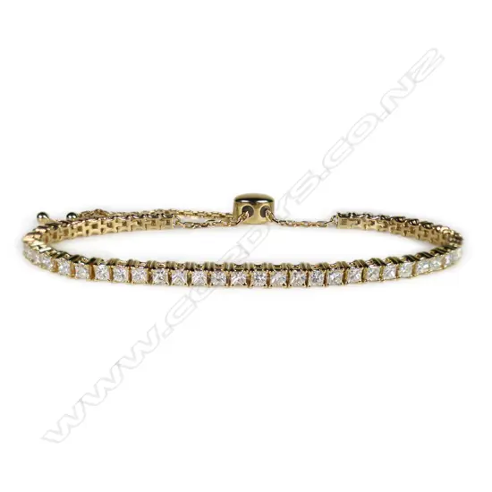 A 14ct gold and diamond bolo style tennis bracelet,