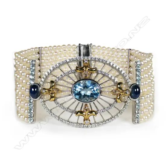 An 18ct white gold diamond aquamarine and multi pearl bracelet,