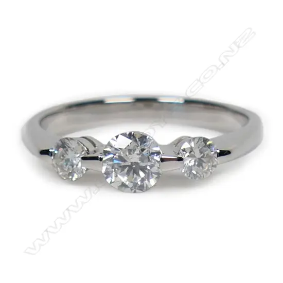 A 14ct white gold and diamond trilogy ring,