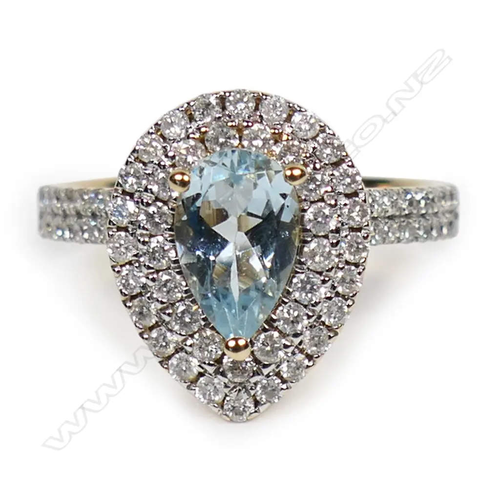 A 14ct gold aquamarine and diamond double halo ring, Image 1++