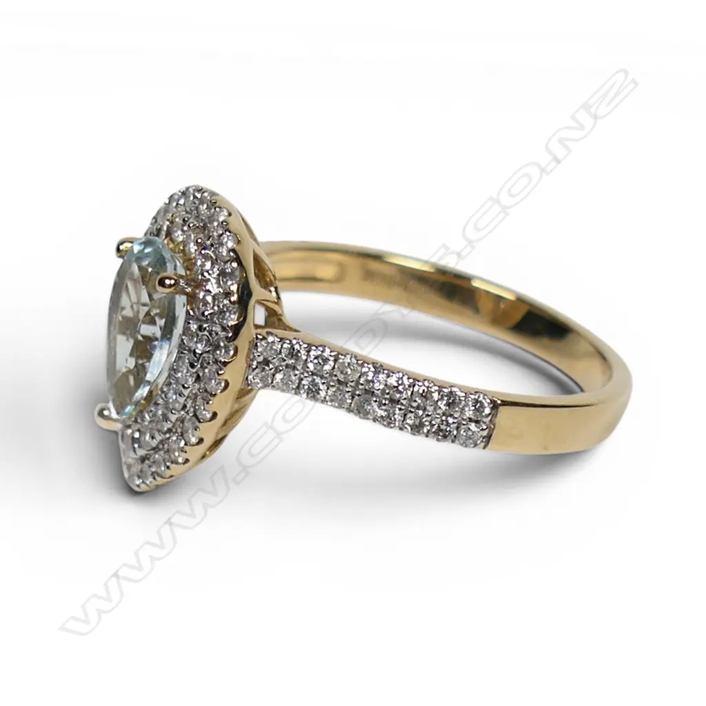 A 14ct gold aquamarine and diamond double halo ring, Image 1++