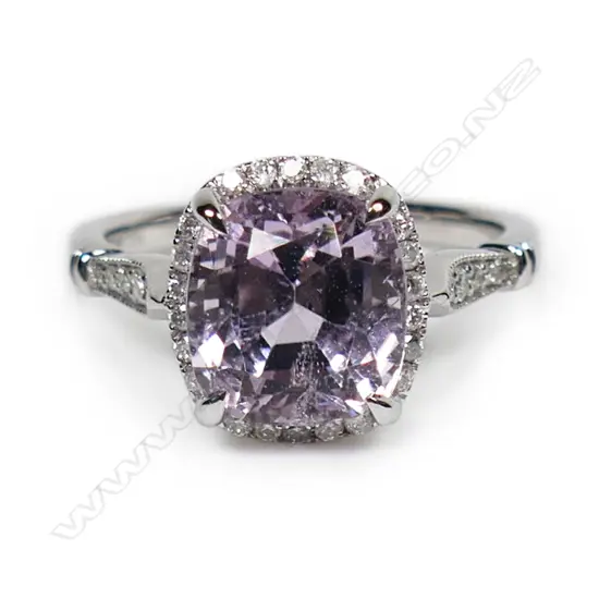 A 14ct white gold kunzite and diamond halo ring,