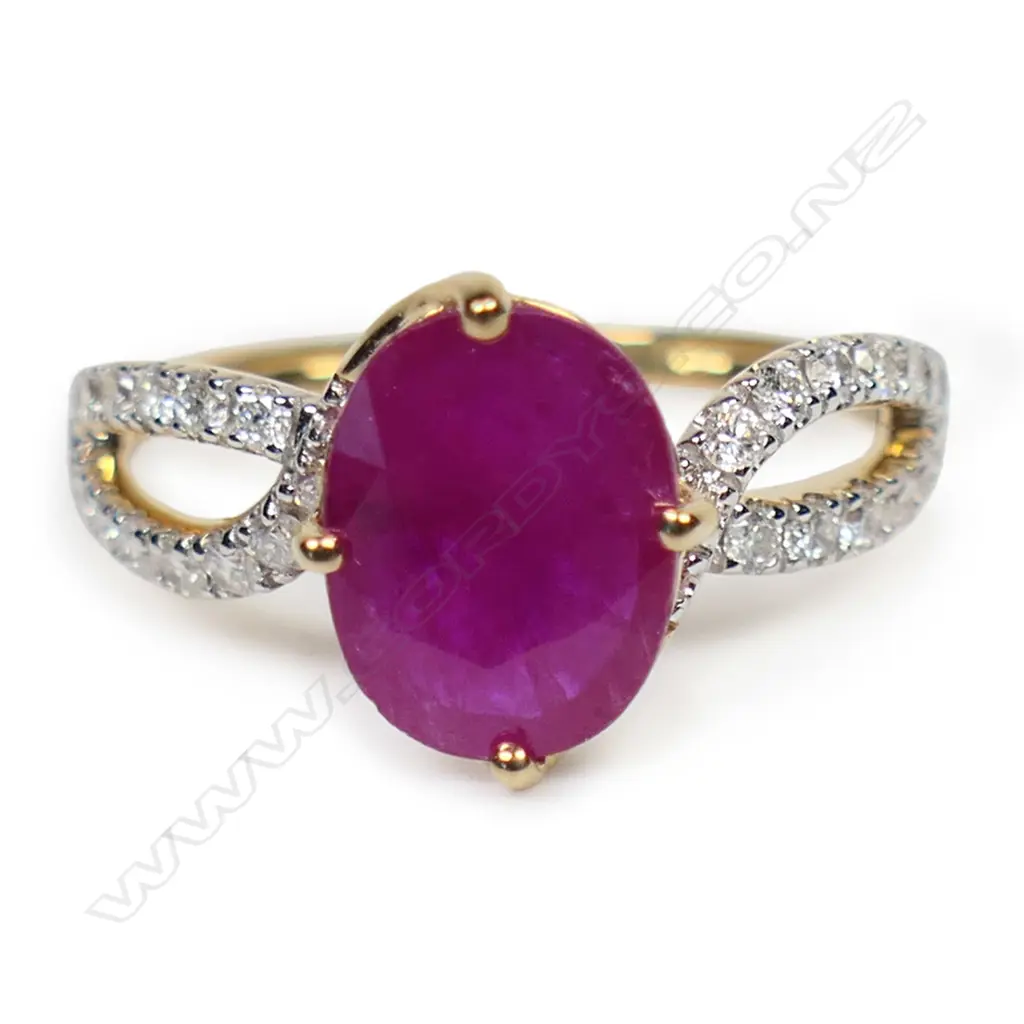 A 14ct gold ruby and diamond twist band ring, Image 1++
