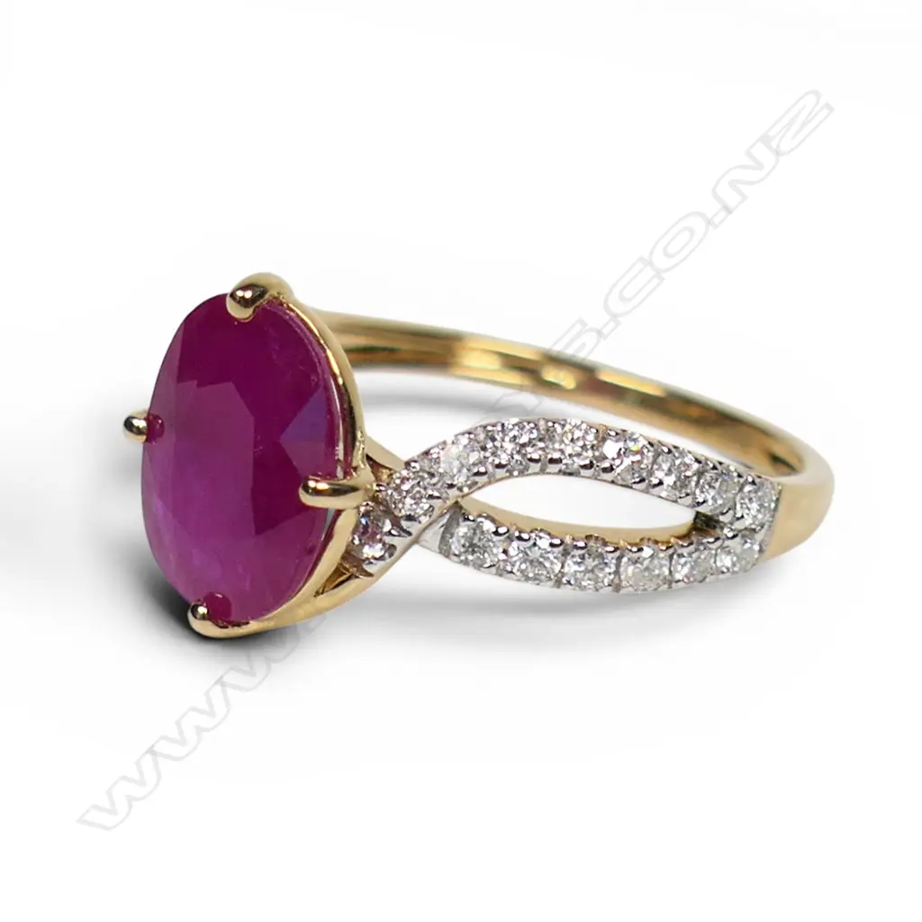 A 14ct gold ruby and diamond twist band ring, Image 1++