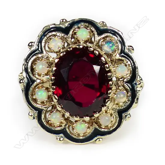 A 14ct yellow gold rhodolite garnet and multi opal ring,