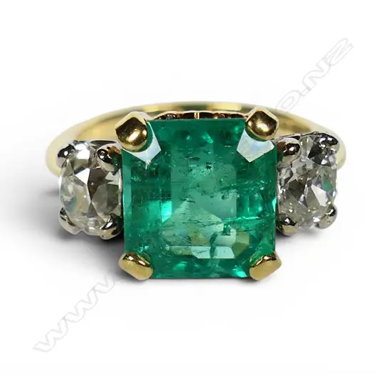An impressive 18ct gold emerald and diamond dress ring,