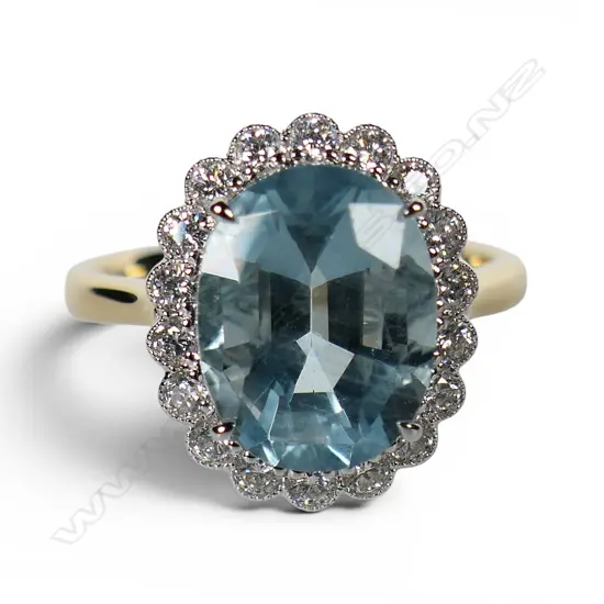 An 18ct gold aquamarine and diamond ring,
