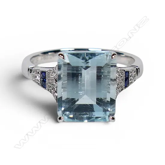 An 18ct white gold aquamarine and diamond Art Deco style ring,