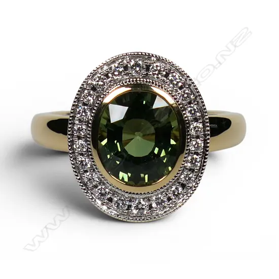 An 18ct gold green sapphire and diamond ring,