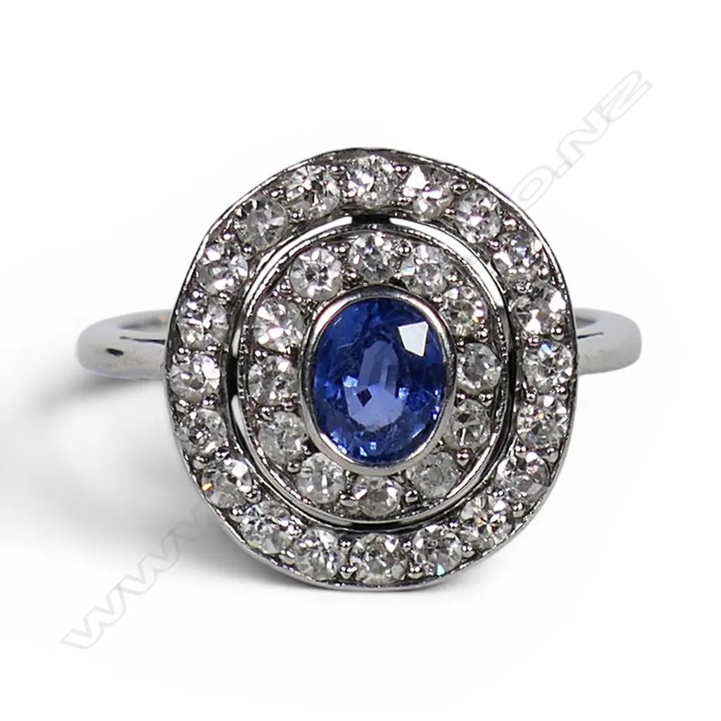 A platinum diamond and sapphire dress ring, Image 1++