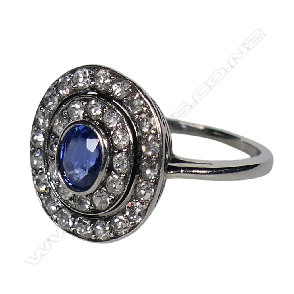 A platinum diamond and sapphire dress ring, Image 1++
