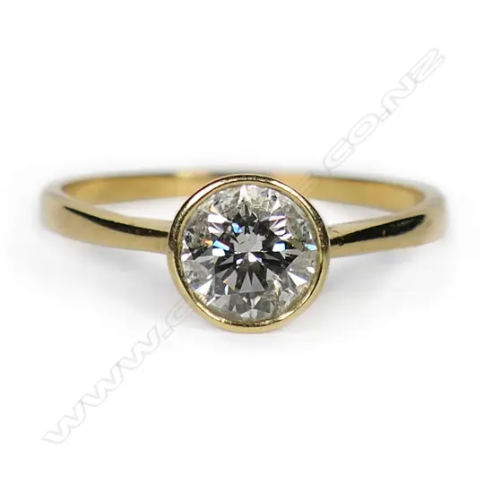 An 18ct gold and diamond solitaire ring,
