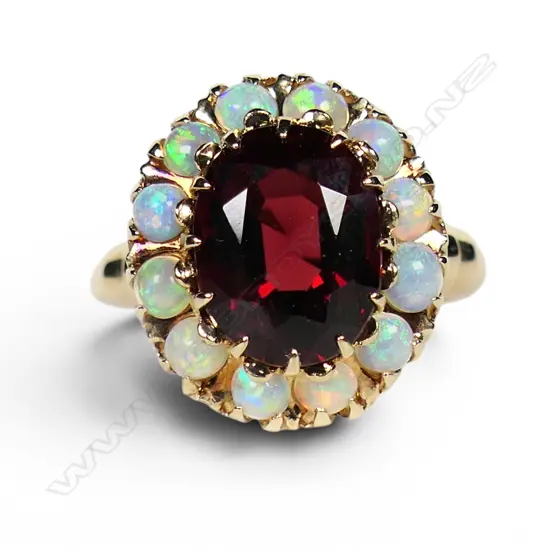 A 10ct rose gold rhodolite garnet and multi opal cluster ring,