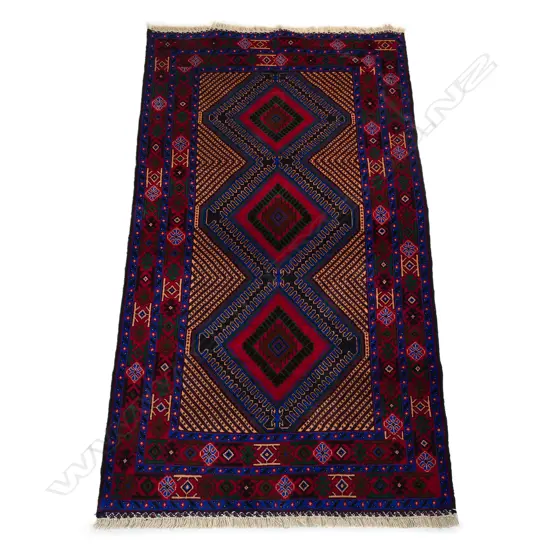 A hand-knotted Baluchi rug,