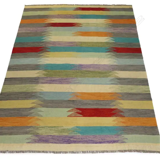 A hand-woven Kilim carpet,