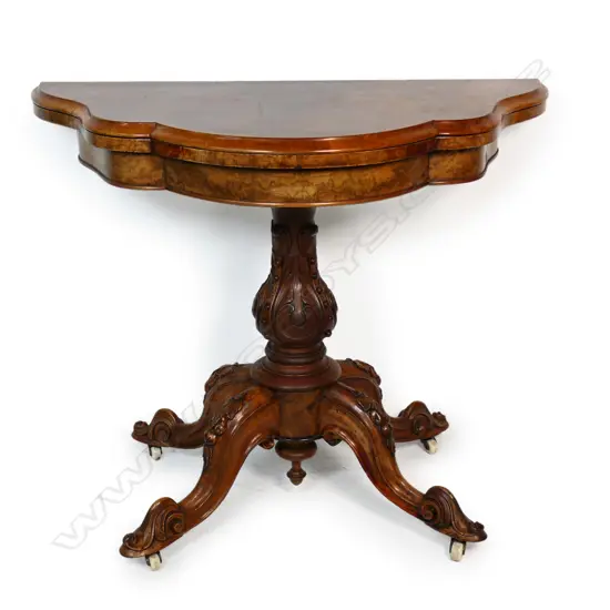 A Victorian walnut card table,