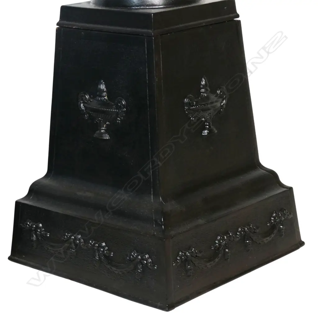 A pair of old refurbished cast iron urns on plinth bases, Image 1++