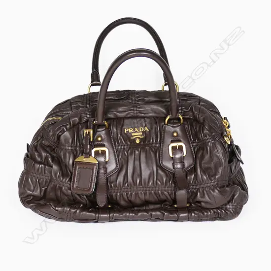 A Prada ruched leather satchel,