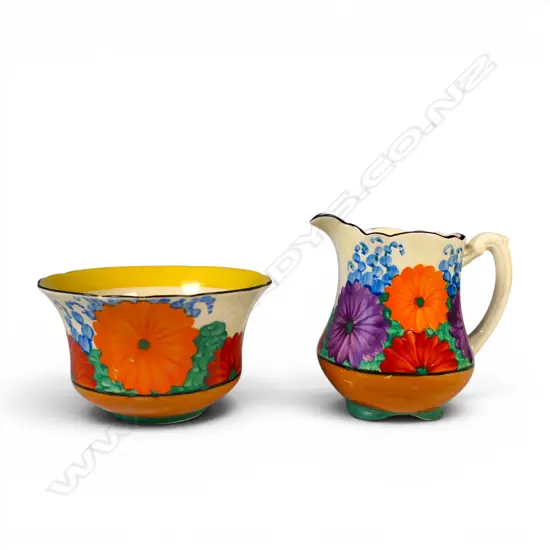 A Clarice Cliff Bizarre cream and sugar,