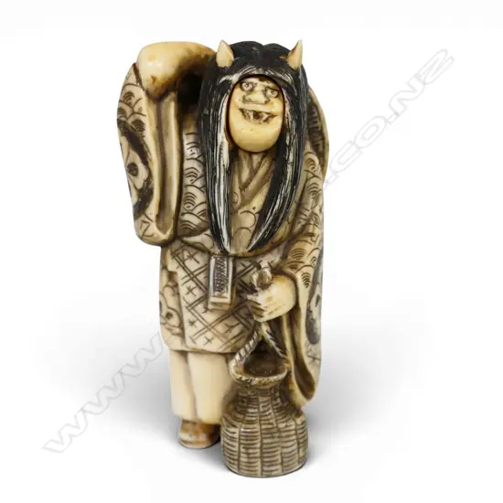 An early 20thC Japanese carved ivory okimono figure of a revolving head Noh actor,