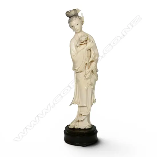 A tall carved solid ivory figurine of Guanyin,