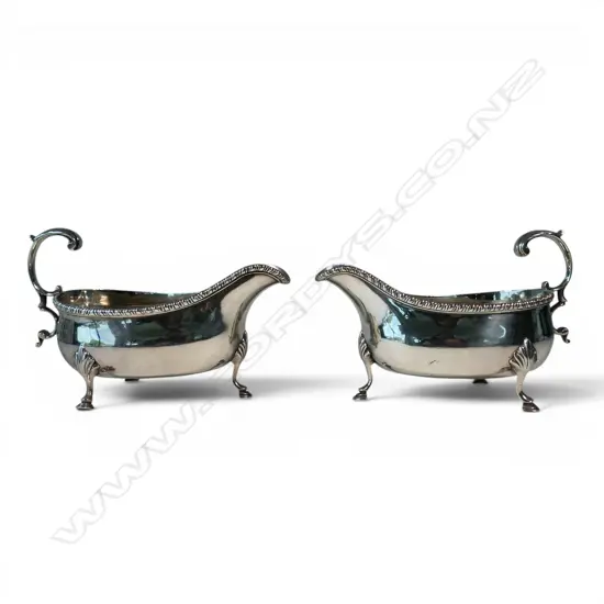 A good pair of George III silver large fat bellied sauce boats,