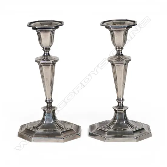 A pair of Edwardian silver column candlesticks,