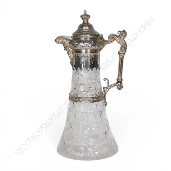 An early 20thC silver plate and crystal wine ewer,