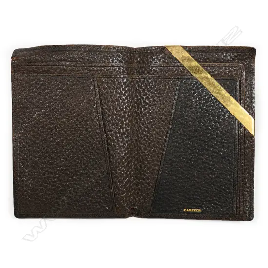 An early 20thC Cartier pig skin wallet with 18ct gold name bar,