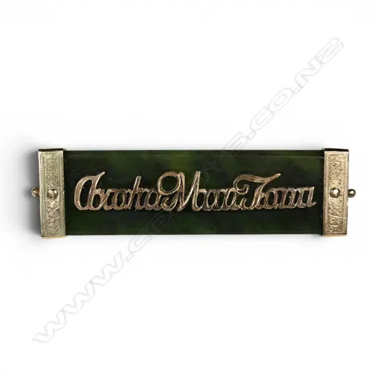 A late-19thC 9ct gold and pounamu brooch 'Aroha Mau Tonu',