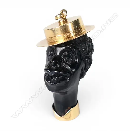 A 9ct gold and jet or ebony carved male head,