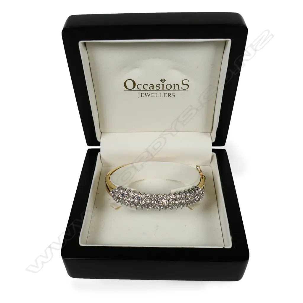 An impressive 18ct-tone gold and multi diamond hinged bangle, Image 1++
