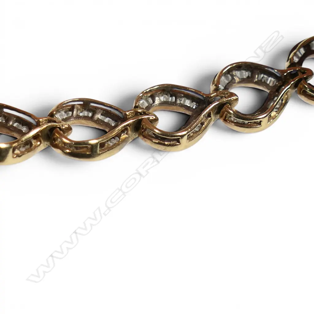 A 10ct yellow gold and multi baguette diamond set bracelet, Image 1++