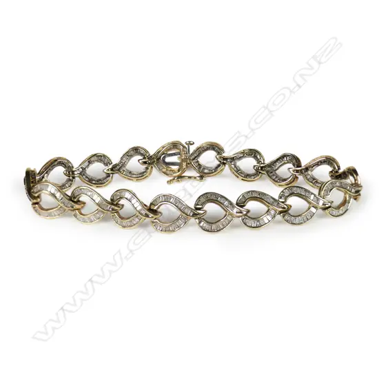 A 10ct yellow gold and multi baguette diamond set bracelet,