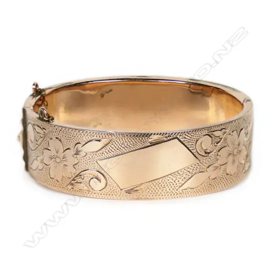 A 9ct rose gold half-hinged bangle,