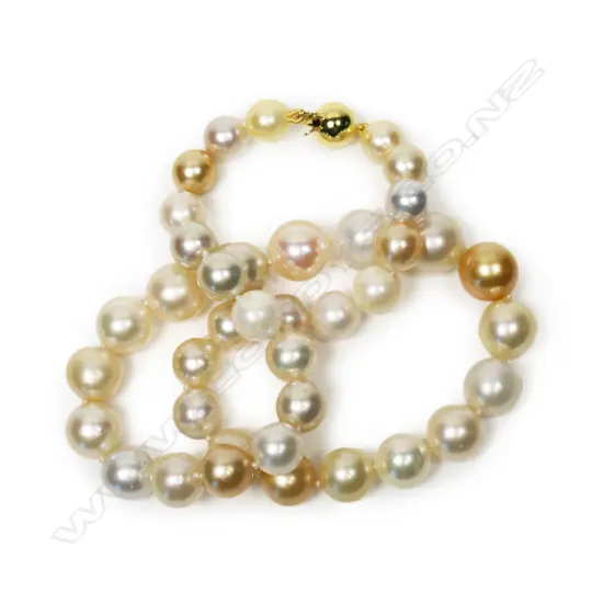 A graduating strand of variously coloured pearls,