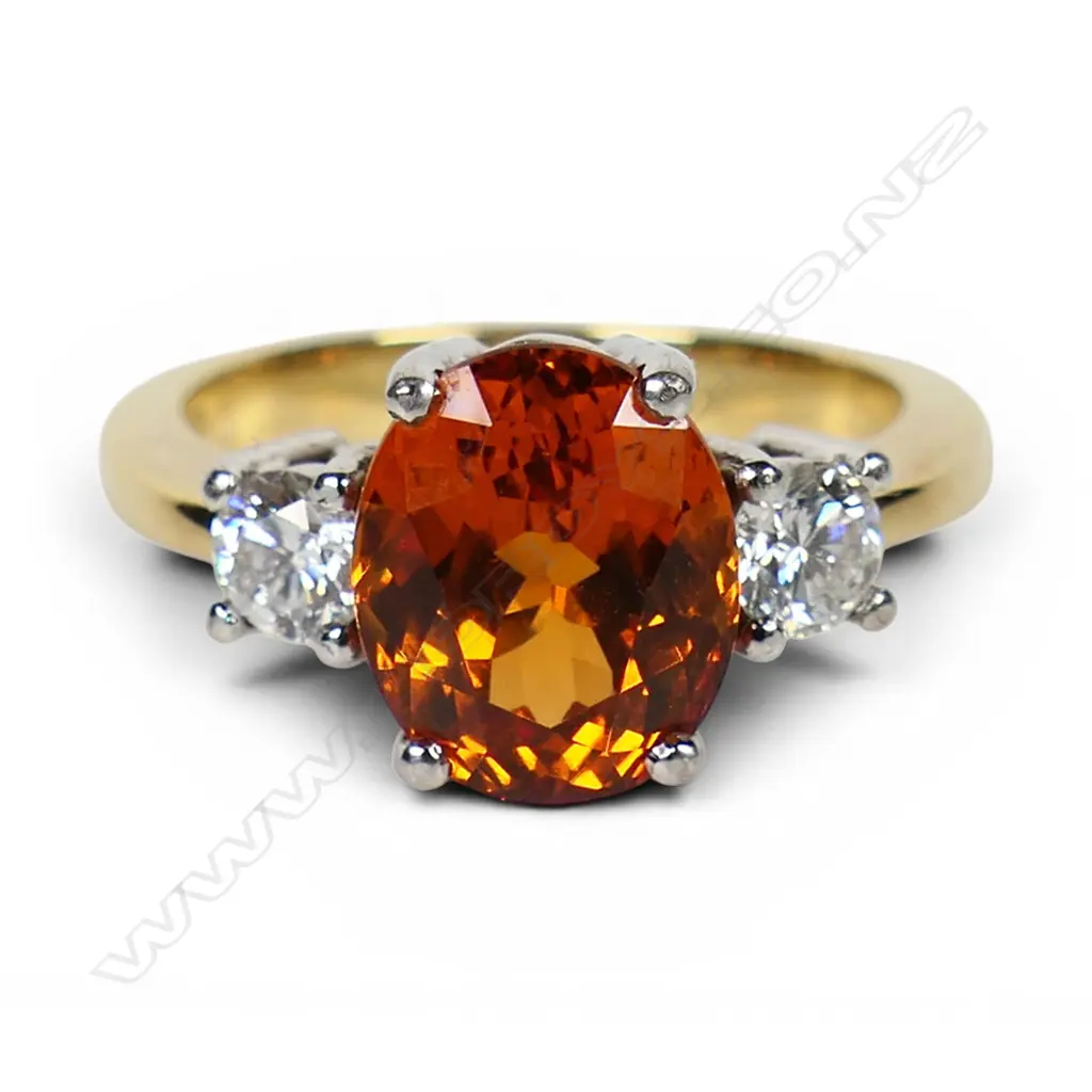 An 18ct yellow and white gold orange garnet and diamond dress ring, Image 1++
