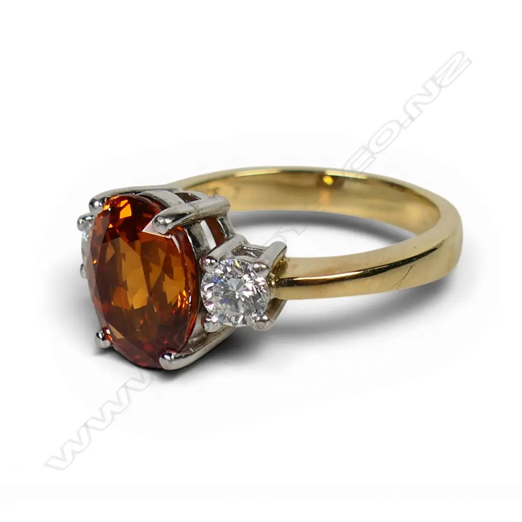 An 18ct yellow and white gold orange garnet and diamond dress ring, Image 1++