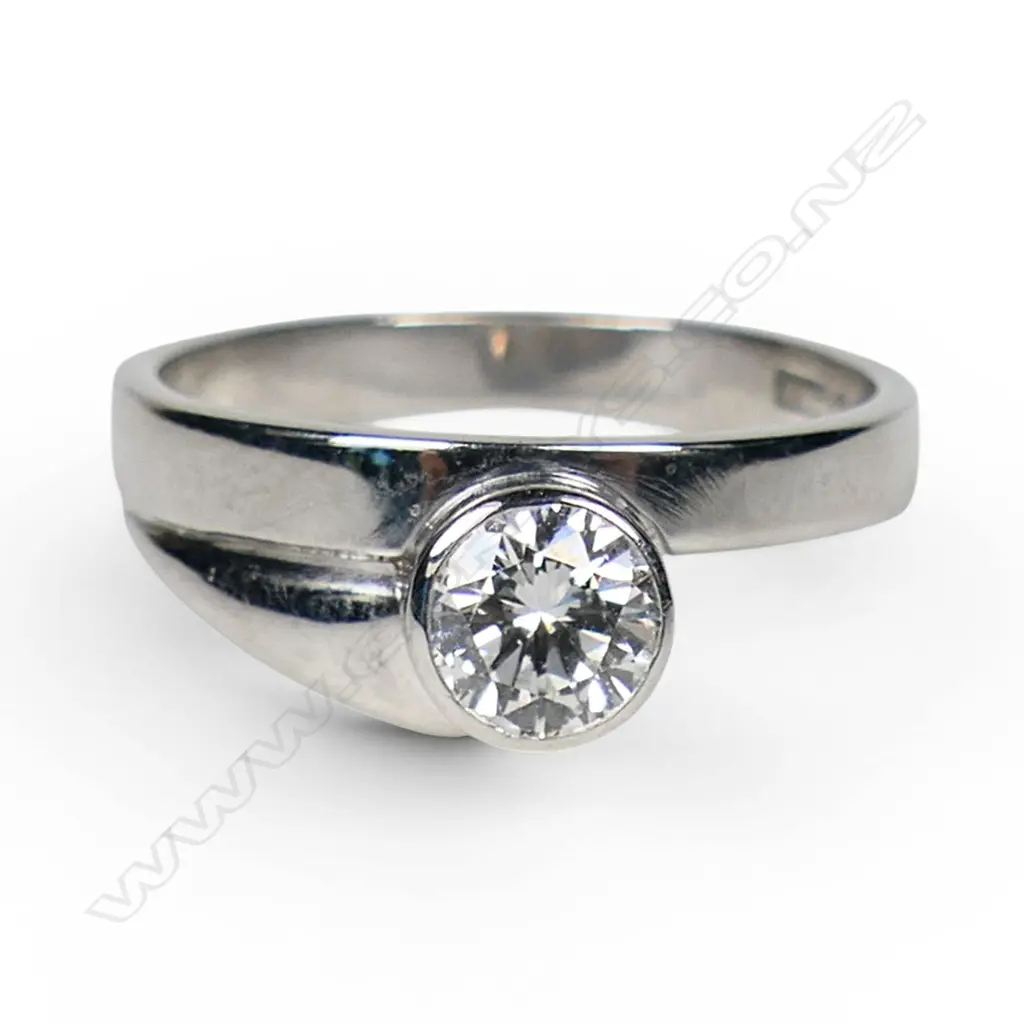 A platinum and solitaire diamond ring, Image 1++