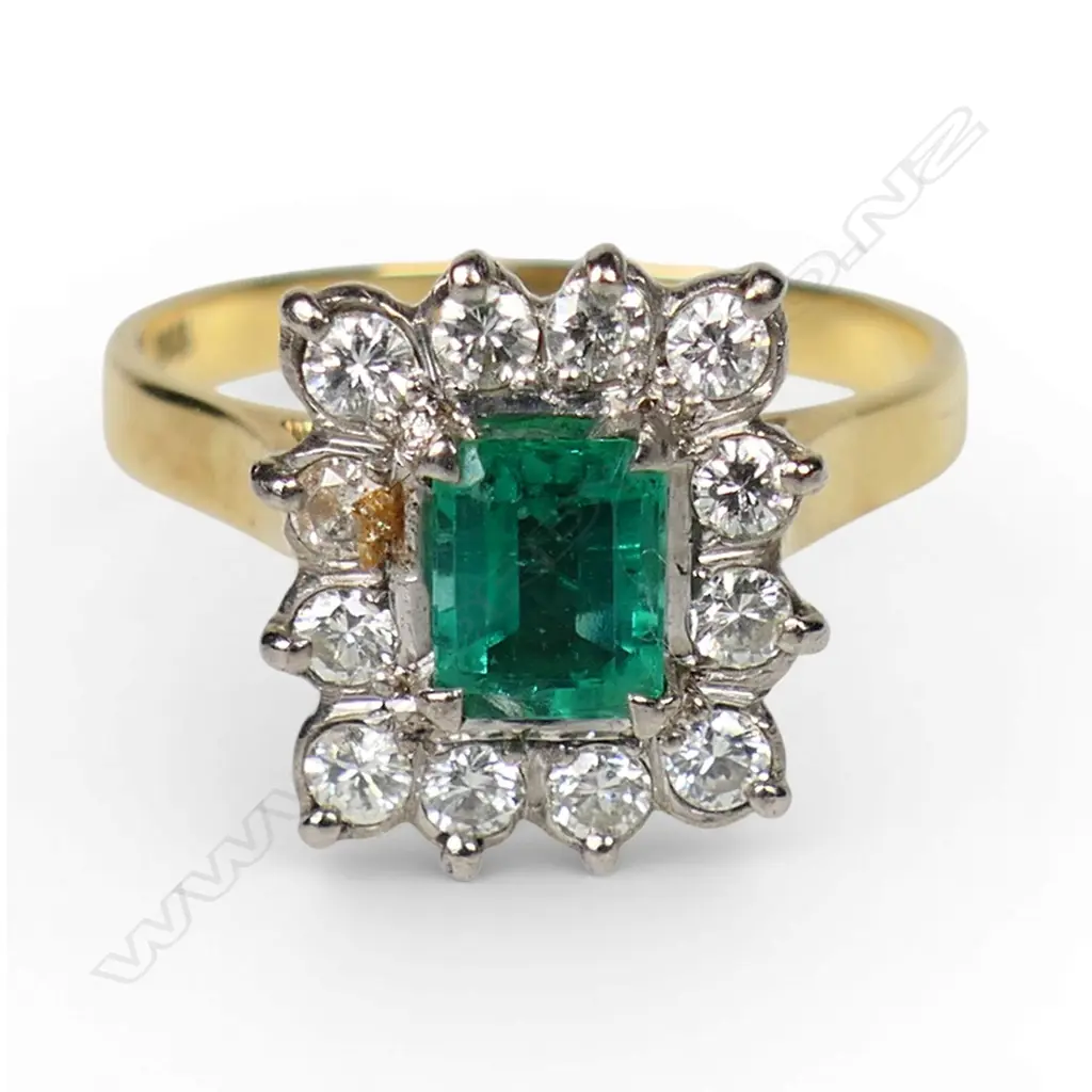 An 18ct gold emerald and diamond ring, Image 1++