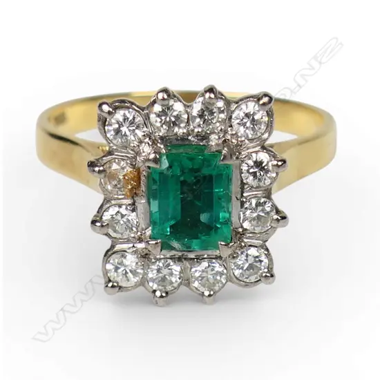 An 18ct gold emerald and diamond ring,