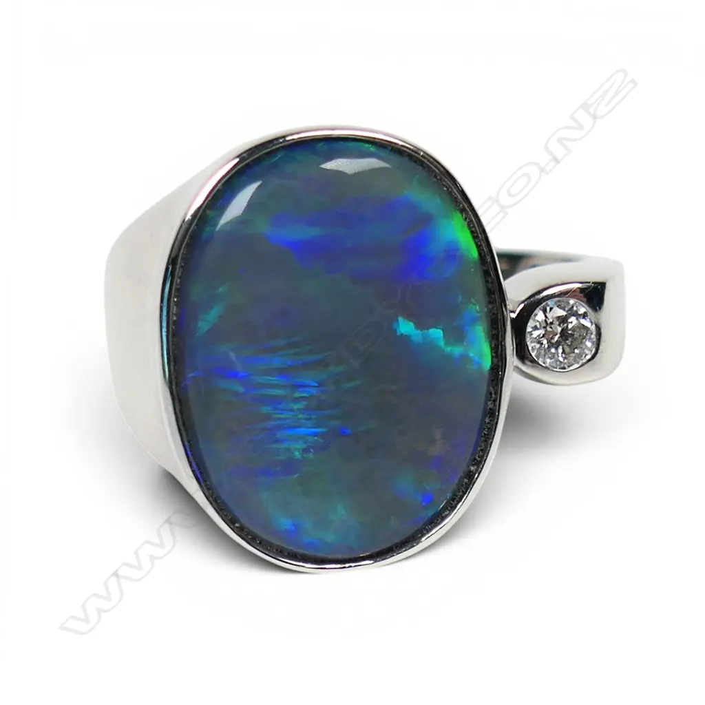 A 14ct white gold opal and diamond ring, Image 1++