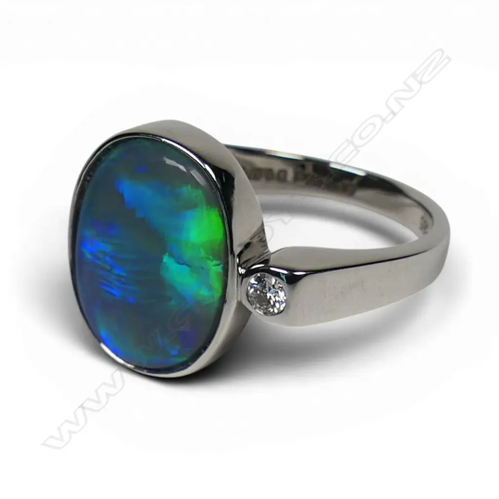 A 14ct white gold opal and diamond ring, Image 1++